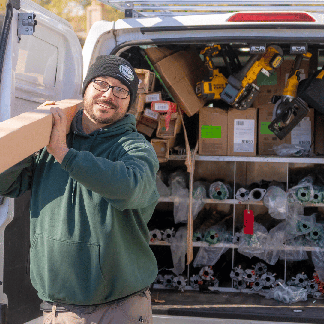 Technician Carrying a Garage Door Spring