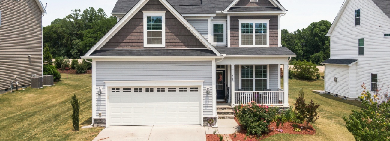 Frontal View of a House with a New Garage Door