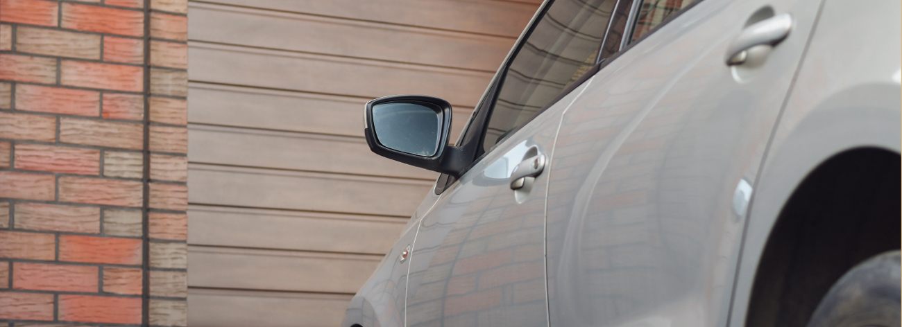 Car Parked in Front of Garage Door